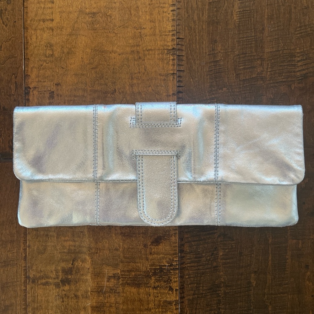 Silver leather clutch with magnetic snap closure 12” x 5.5”
